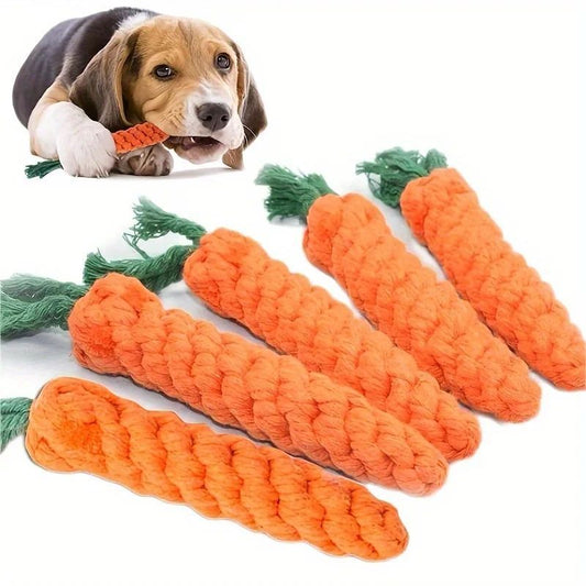 Dog playing with a rope carrot toy on a white background