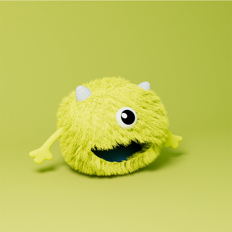 Yellow plush toy with a happy expression on a green background