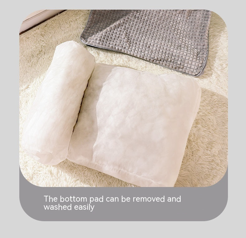 Dog bed with a removable bottom pad on a light gray background