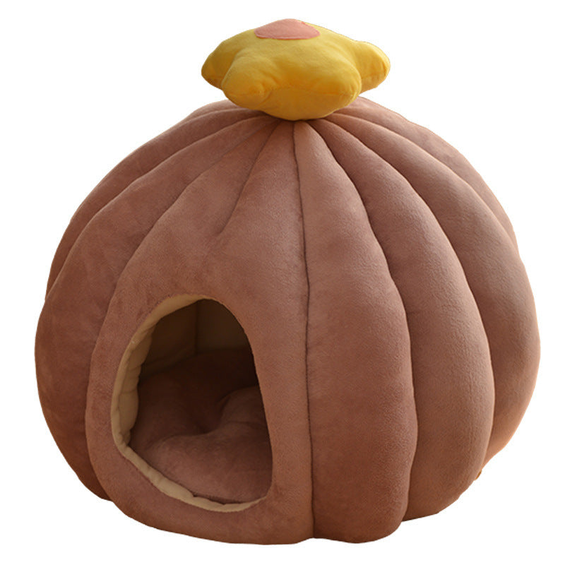 Pumpkin-shaped pet bed with a yellow top on a white background