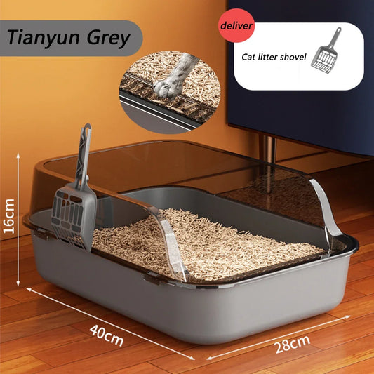 Cat litter box with scoop on a wooden floor, featuring dimensions and a deliver logo.