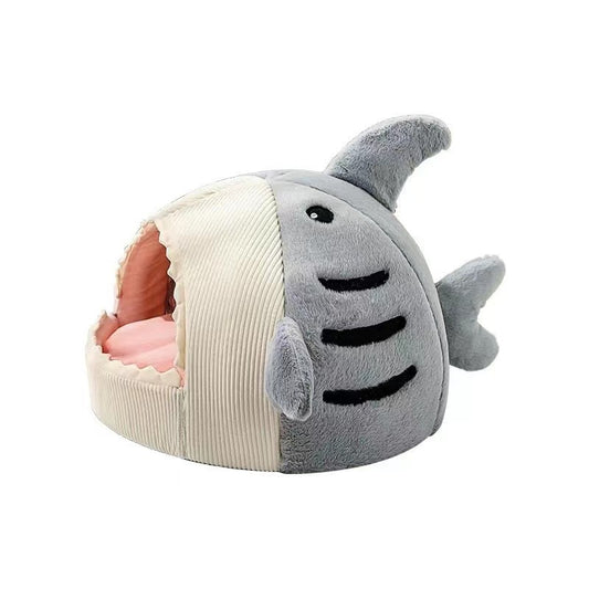 Plush shark-shaped pet bed on a white background