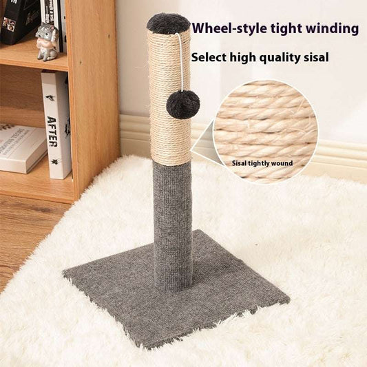 Cat scratching post with sisal wrap on a white rug, next to a wooden shelf.
