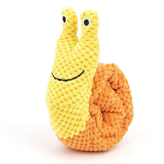 Crocheted snail toy with a yellow body and brown shell on a white background